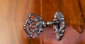 Old antique skeleton key in lock of wooden cabinet Royalty Free Stock Photo