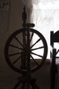 Old Antique Spinning Wheel on wood background Royalty Free Stock Photo