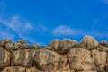 Old antique stone wall texture board with empty blue sky background, copy space Royalty Free Stock Photo