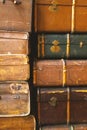 Old antique suitcases, close-up. Vintage retro styled texture. Vertical toned