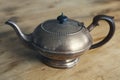 Old antique teapot on wooden table Royalty Free Stock Photo