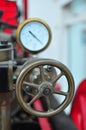 Old antique vintage fire pump pressure gauge and wheel