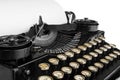 Old antique vintage portable typewriter, close-up of the mechanism, font and a blank sheet of paper. Royalty Free Stock Photo
