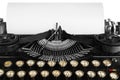 Old antique vintage portable typewriter, close-up of the mechanism, font and a blank sheet of paper. Royalty Free Stock Photo
