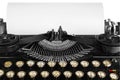 Old antique vintage portable typewriter, close-up of the mechanism, font and a blank sheet of paper. Royalty Free Stock Photo