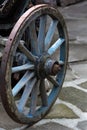 An old antique wagon wheel made of wood and metal Royalty Free Stock Photo