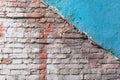 Old, antique wall of red destroyed bricks. White plaster was applied over the brickwork. Royalty Free Stock Photo