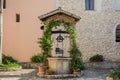 ROMA, ITALY - JULY 2019: Old antique well in flowers Royalty Free Stock Photo