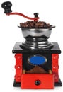 Old antique wooden black and red coffee grinder, coffee beans an Royalty Free Stock Photo