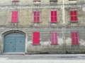 Old apartments for sale with pink shutters in Italy Europe