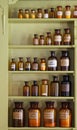 Old apothecary cabinet with storage jars Royalty Free Stock Photo