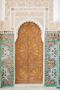 Old Arabian style gate entrance with a wooden closed door in Marrakesh landmark Royalty Free Stock Photo