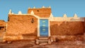 Old Arabic House with Door and Antique Lanterns - Traditional Arab Mud Architecture - Part of an Old Fort Ã¢â¬â Home Made of Sand Royalty Free Stock Photo