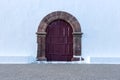 Old arch wooden door of a church