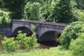 Old arched span bridge countryside river