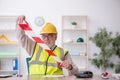Old male architect holding caution tape Royalty Free Stock Photo