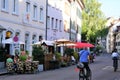 Basel Switzerland sidewalk restaurants, cyclists August 2019
