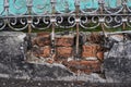 Old architecture. Many small debris. Destroyed brick wall