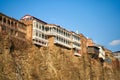 Old architecture of Tbilisi. Dense development of a residential building on a cliff by the river Royalty Free Stock Photo