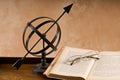 Old Armillary and book.
