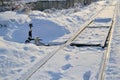 Old arrow train and railway tracks in the winter under the snow Royalty Free Stock Photo