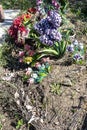 old artificial flowers on grave mound in cemetery