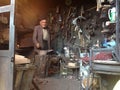 Old artisan man working in his blacksmith shop in Roudbar, Iran