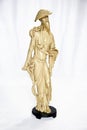 An old arty oriental statuette isolated over white. Craftsmanship.