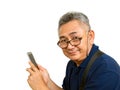 Old Asain man holds mobile phone and smiles