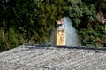 An old asbestos roof made of corrugated tiles is a hazardous environmental waste that must end up in a special landfill or in a re