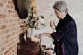 Old asian elderly senior elder woman dialing telephone number Royalty Free Stock Photo