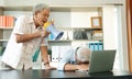 Old Asian elderly yell to a megaphone to talk with a friend for communication. Concept of communication problem in aging cause of