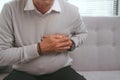 Old asian man has a sudden heart attack Royalty Free Stock Photo