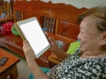 Old asian women very happy Look at the tablet