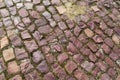 Old asymmetric granite brick pavement