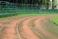 Old athletic curved track with bleacher Royalty Free Stock Photo