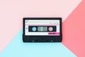 Old audio tape cassette on a multicolor background. Top view, old technology concept Royalty Free Stock Photo