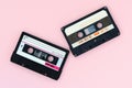 Old audio tape cassettes on a pink background. Top view, old technology concept Royalty Free Stock Photo