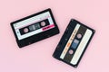 Old audio tape cassettes on a pink background. Top view, old technology concept Royalty Free Stock Photo