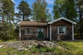 Old authentic cabin house in the woods. Dacha guest house. Nobody there. Old wooden building among forest trees for tourists relax