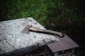 Old ax on the rural table with bubble wrap