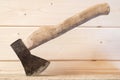 Old ax with a wooden handle in the beam Royalty Free Stock Photo