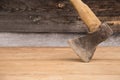 Old ax with a wooden handle stuck in wooden log. Concept for woodworking or deforestation. Selective focus. Royalty Free Stock Photo