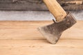 Old ax with a wooden handle stuck in wooden log. Concept for woodworking or deforestation. Selective focus. Royalty Free Stock Photo