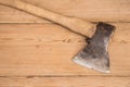 Old ax with a wooden handle stuck in wooden log. Concept for woodworking or deforestation. Selective focus. Royalty Free Stock Photo