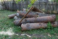 Old axe standing against a piled pieces of firewood Royalty Free Stock Photo