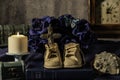 Old baby shoes on blue bible with cross Royalty Free Stock Photo