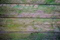 Old background, cracked surface, paint with scratches, wet painted wood and boards. Royalty Free Stock Photo