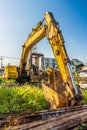 Old backhoe and steel rods at construction site Royalty Free Stock Photo