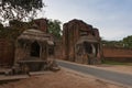 The gate to the Old Bagan Palace with Buddha statues in the niches